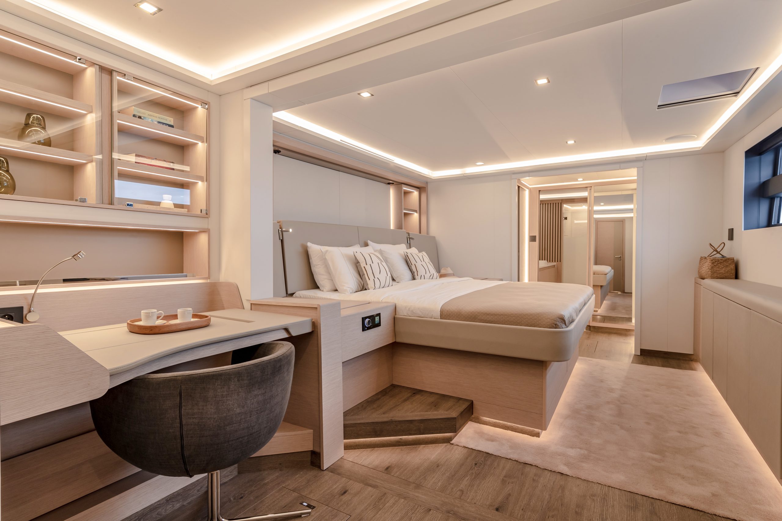 Owner's cabin of the Fountaine Pajot Thira 80 with a wide bed, natural light and a view over the sea